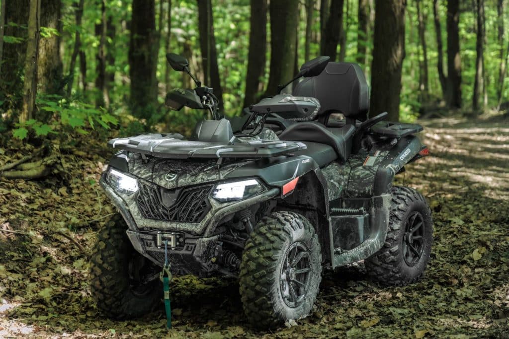 Rider on a CFMOTO CFORCE 600 Touring 2024 during a test drive.